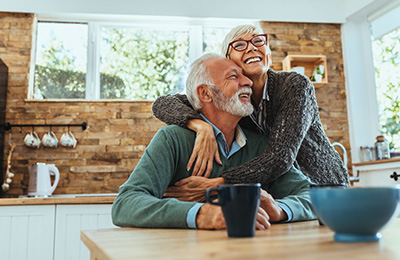 happy elderly couple enjoying each other's company in a cozy kitchen celebrating 16 years together